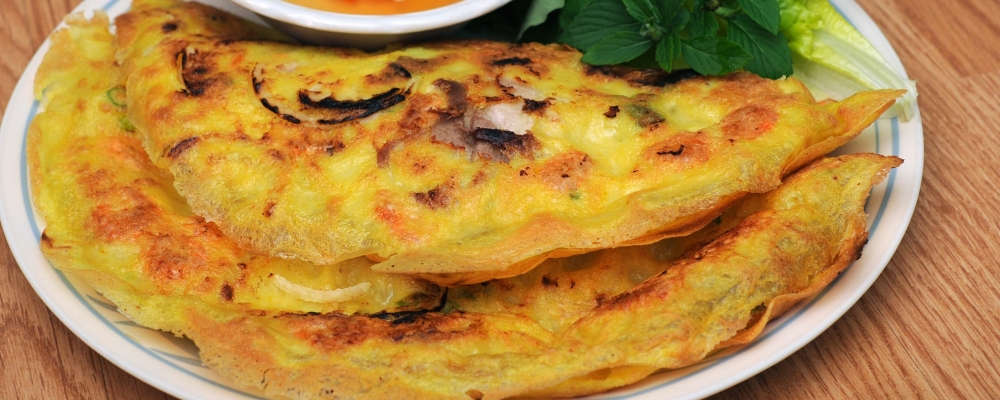 Gluten free turmeric pancakes with carrot hummus and vegetables